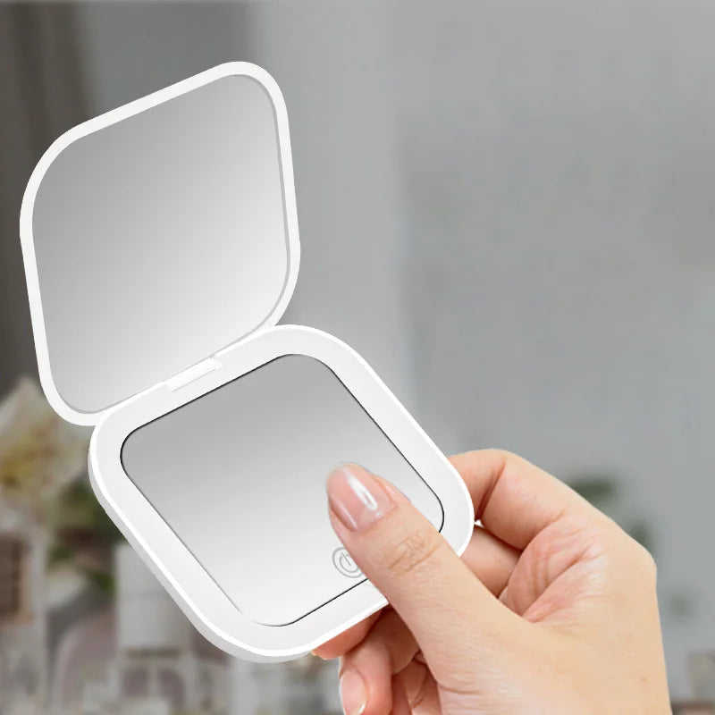 Small folding mirror with lights